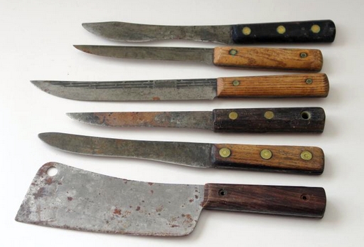 19th century kitchen knives, steel with wooden handles and brass rivets