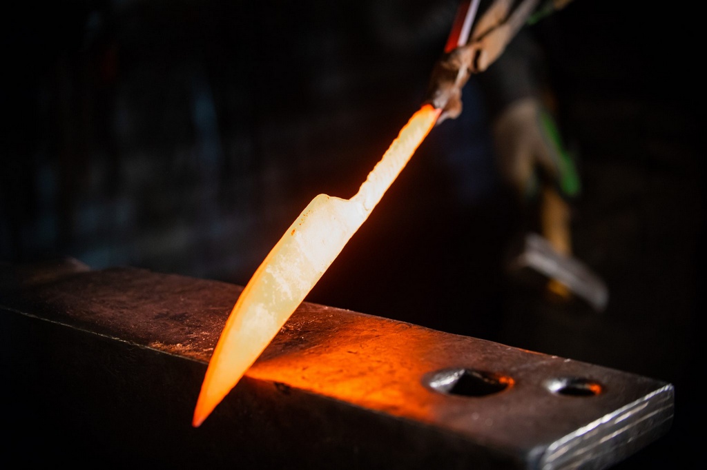 a drop forged kitchen knife with full tang being made by a bladesmith