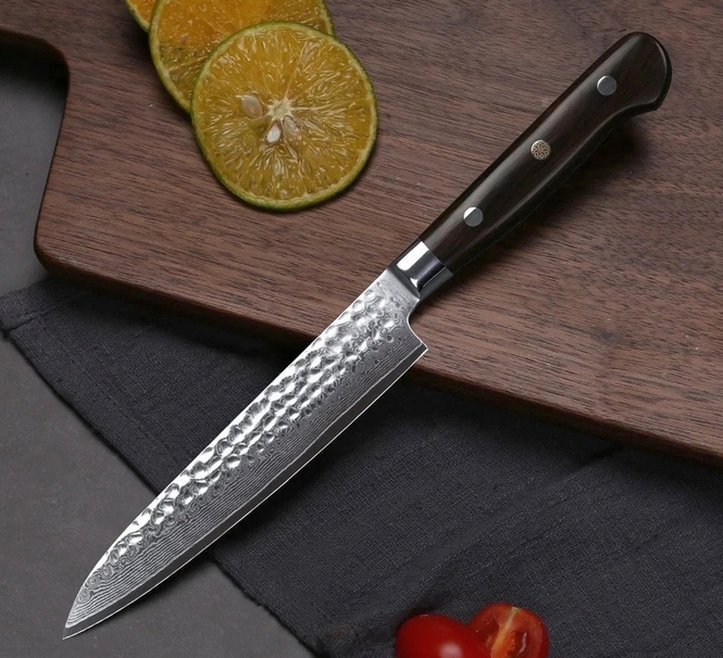 Yoshihiro brand Japanese kitchen knife on a cutting board
