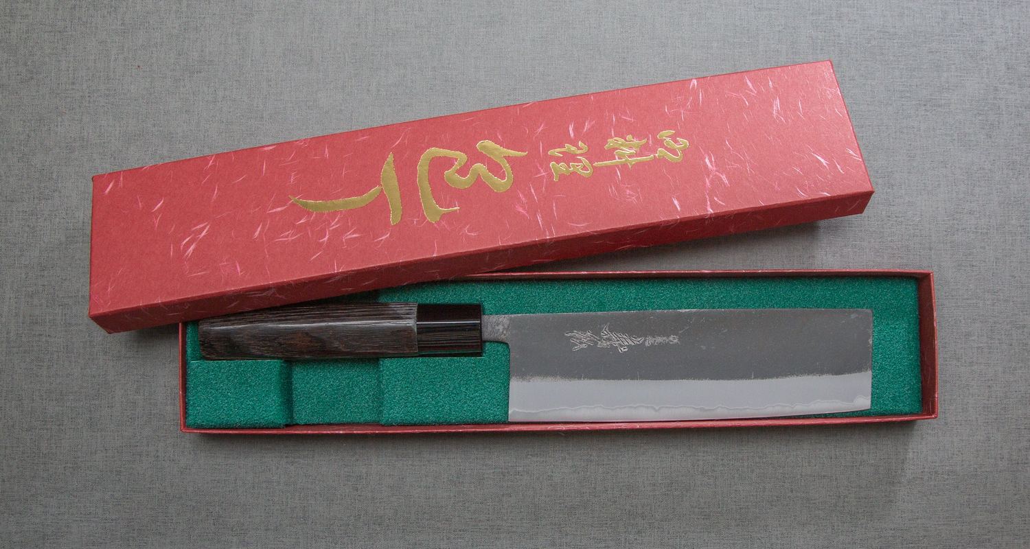 A Yoshihiro kitchen knife in its retail packaging box