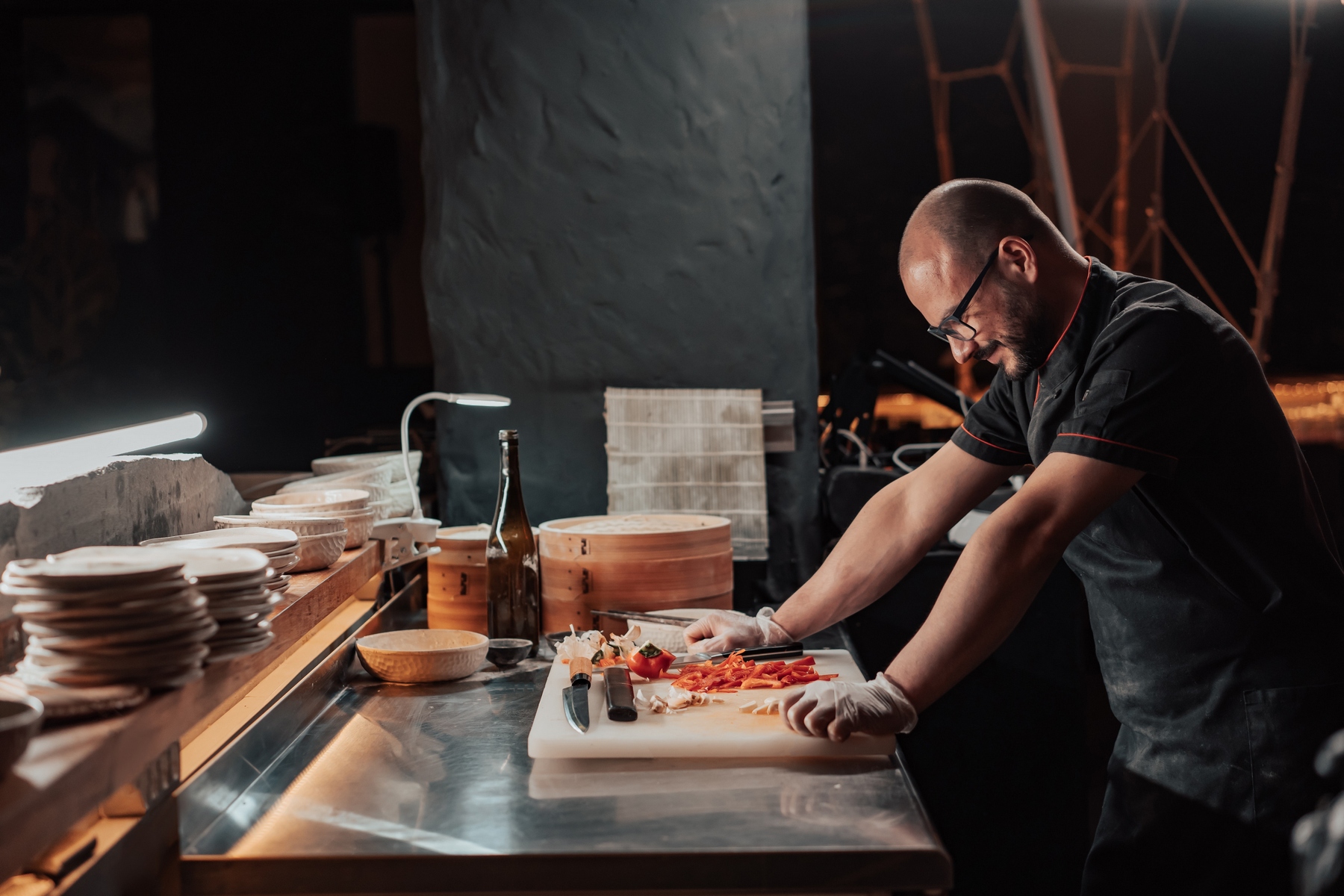 image of a cook in his kitchen tying new chef knives